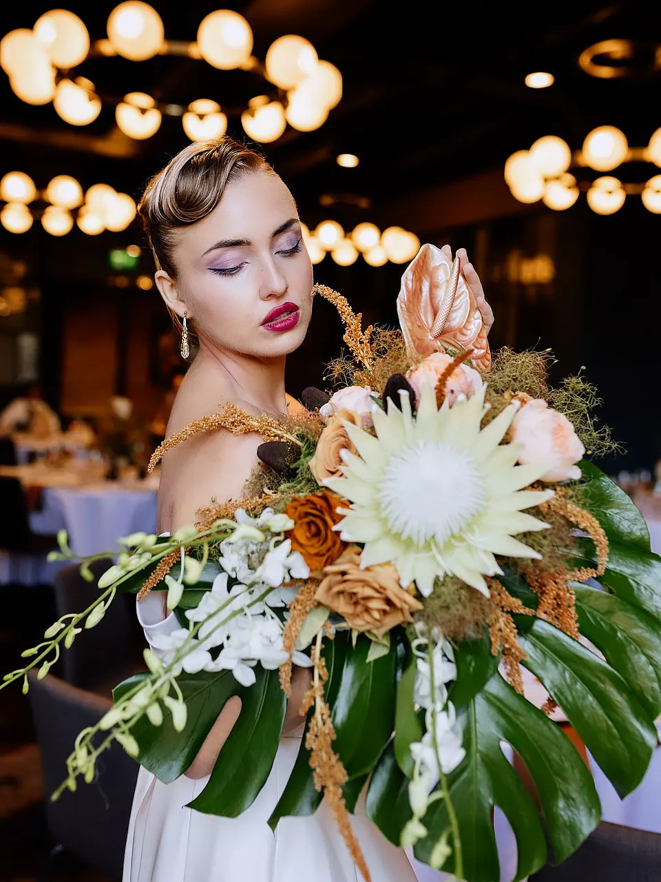 Paula Maria Rosalia holding flowers in an evening beauty portrait