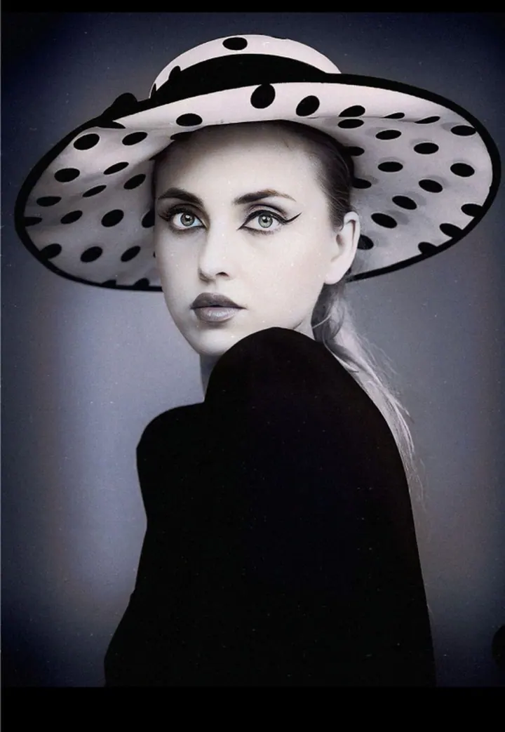 Paula Maria Rosalia in a black and white polka-dot hat editorial portrait