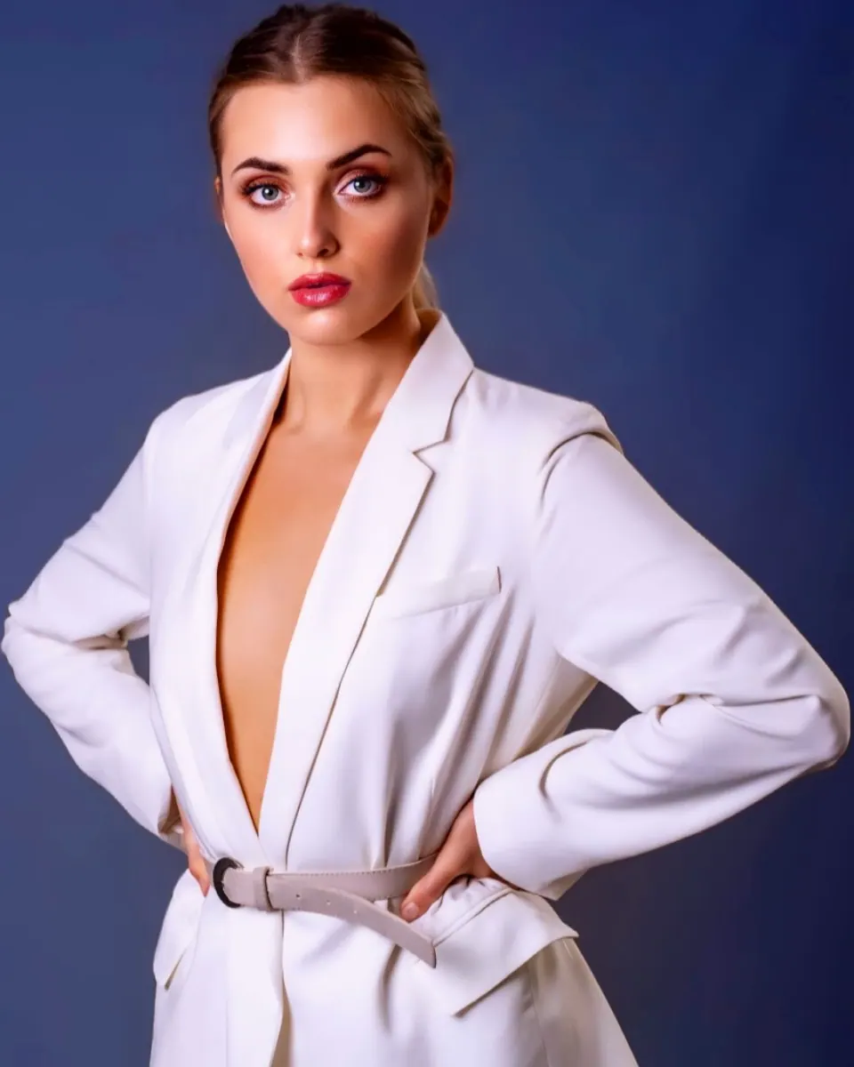 Paula Maria Rosalia in a white blazer studio fashion portrait